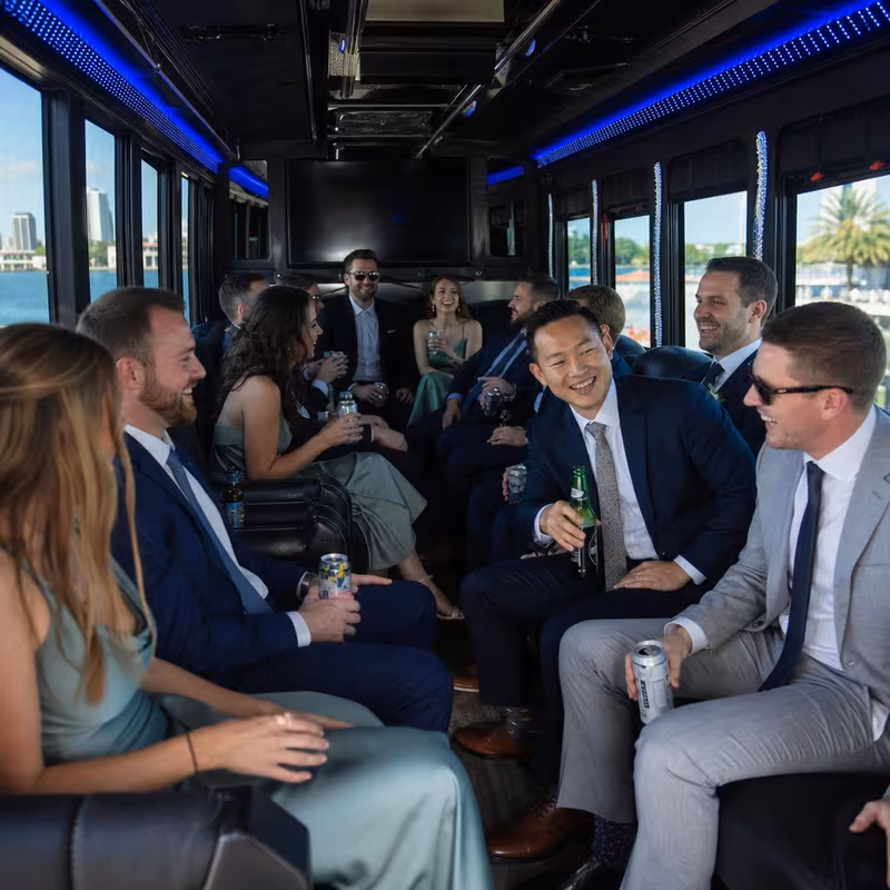 Wedding guests seated inside a Orlando party bus