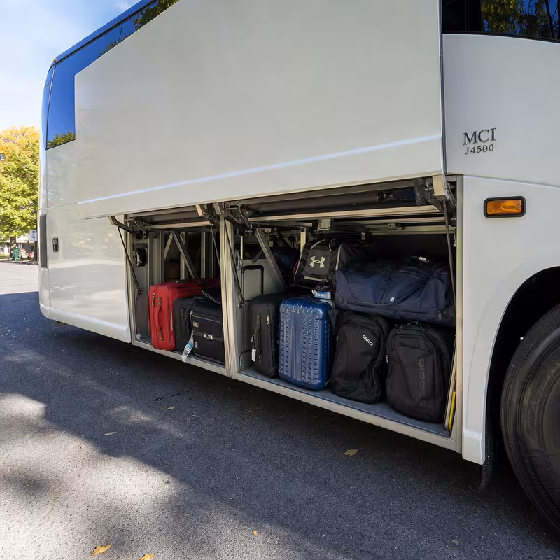 Party bus interior with wraparound leather seating and LED lighting in Orlando
