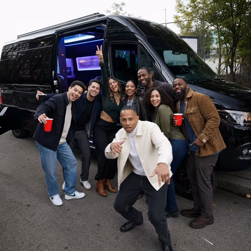 Group boarding a white charter bus for Birthday Transportation transportation in Orlando