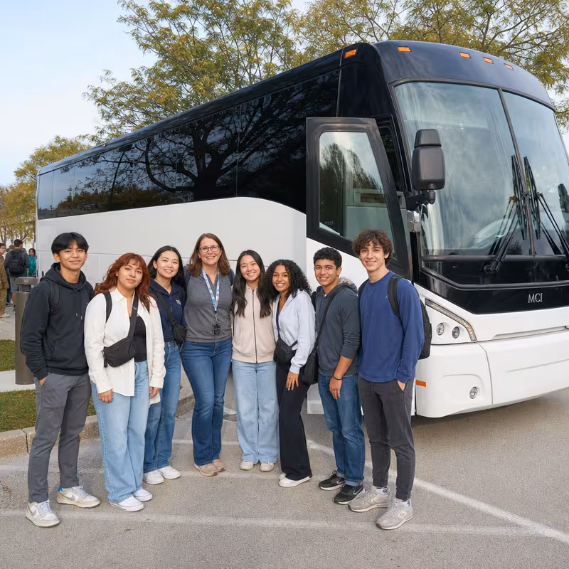 Passengers loading luggage while boarding an Orlando group shuttle
