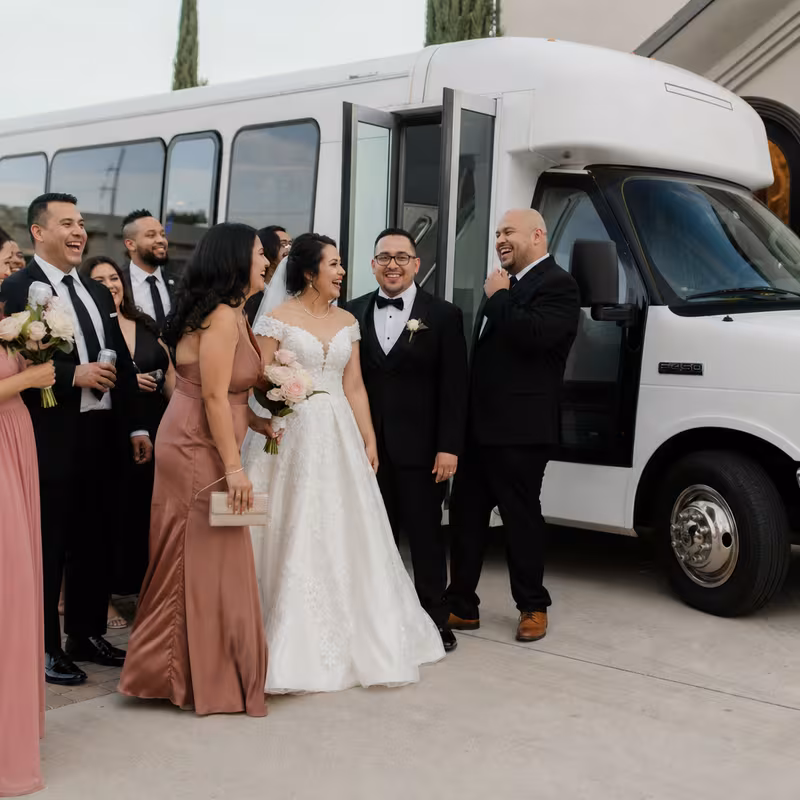 Passengers loading luggage while boarding an Orlando group shuttle